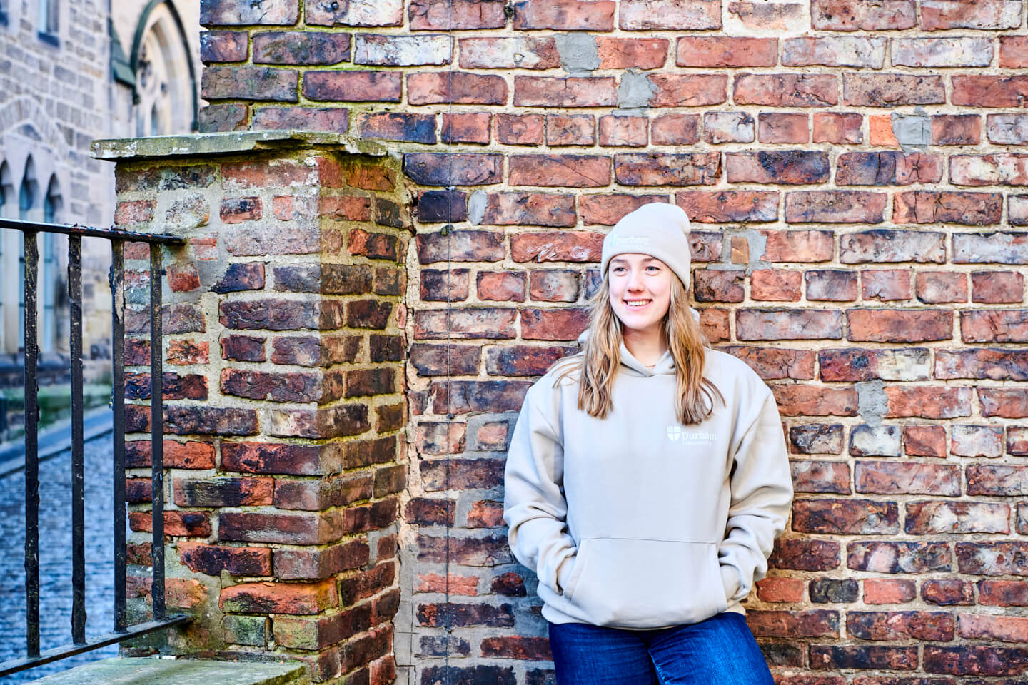 student wearing stone hoody and almond beanie