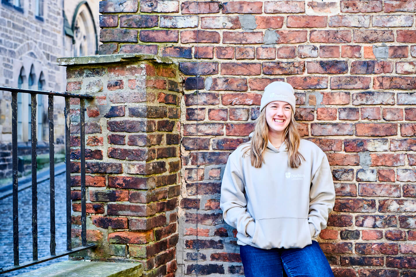 student wearing stone hoody and almond beanie